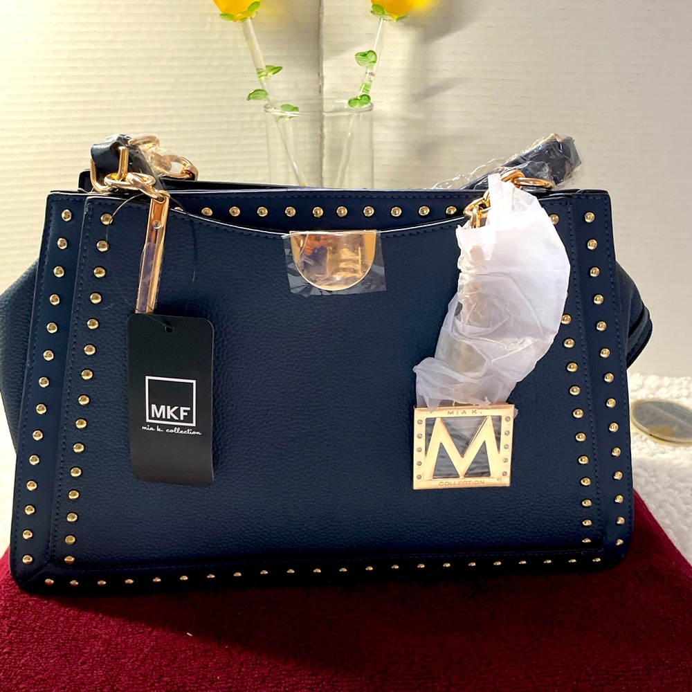 MKF collection, blue leather studded handbag.